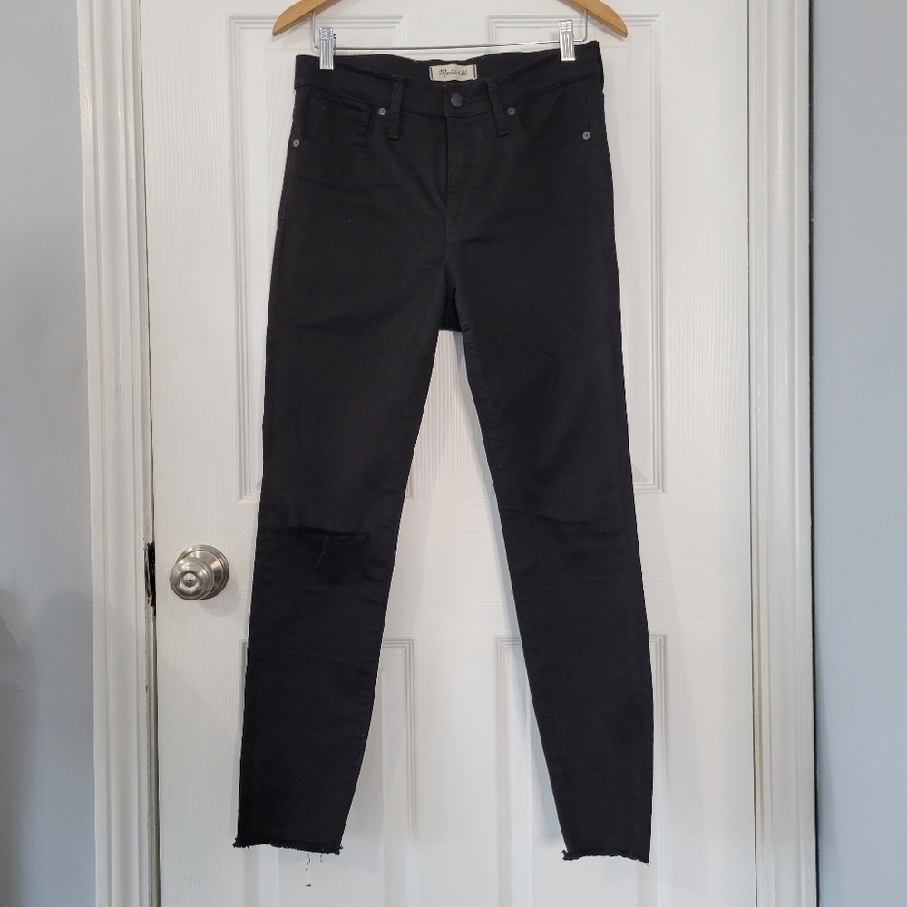 Madewell 9" High Rise Skinny in black. Raw hem and distressed